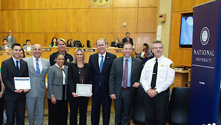 San Diego Police Department Dispatcher Danielle Schule (center) earned the 2017 City of San Diego/National University Professional Development Scholarship.