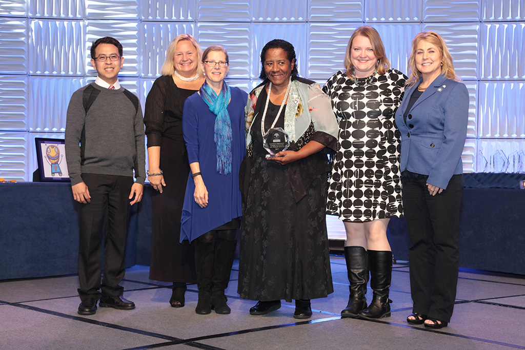 Dr. Gloria McNeal, Dean of the School of HHS (center) at National University, accepted the Planetree Silver Recognition on behalf of the School