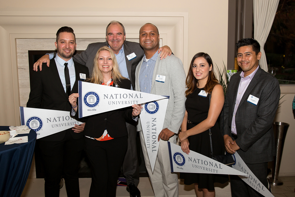 NU Scholars pictured with NU President Dr. David Andrews and NU Scholars Program Assoc. Director Patricia Cardozo.