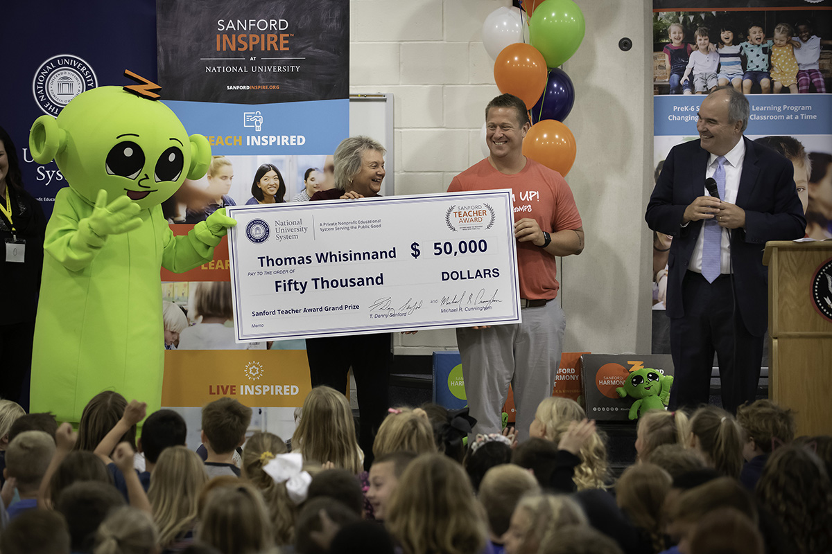 Tom Whisinnand of Nebraska named first-ever Grand Prize recipient of the National University-Sanford Teacher Award. Award presented by National University President Dr David Andrews and Dr Judy Mantle, dean National University’s Sanford College of Education