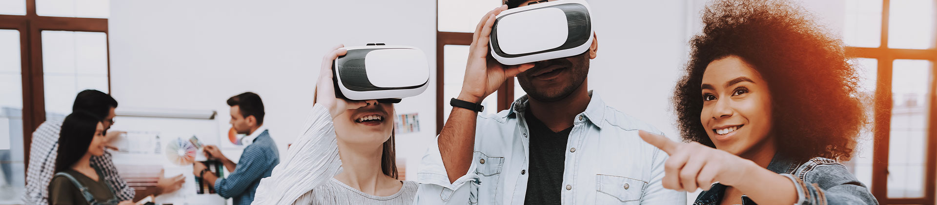 3 people in office, two of them wearing vr headsets