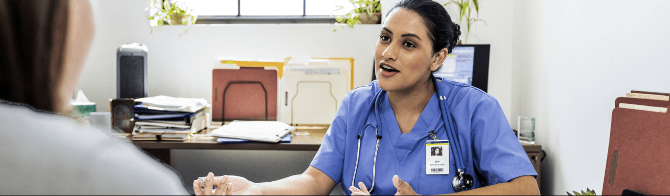 a nurse practitioner talking to a patient