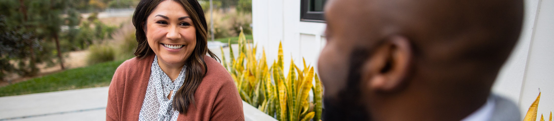 middle aged woman smiling at man