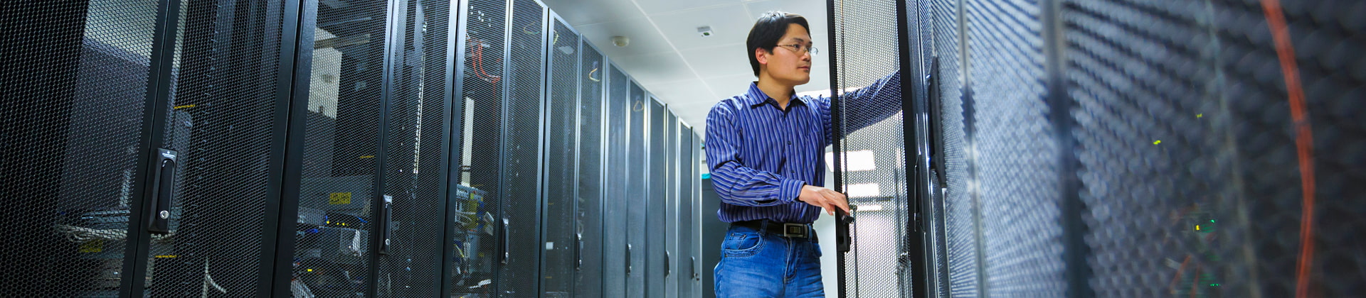 man standing at server racks