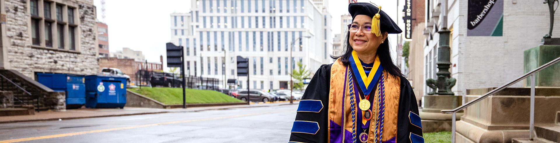 Woman standing outside it regalia 