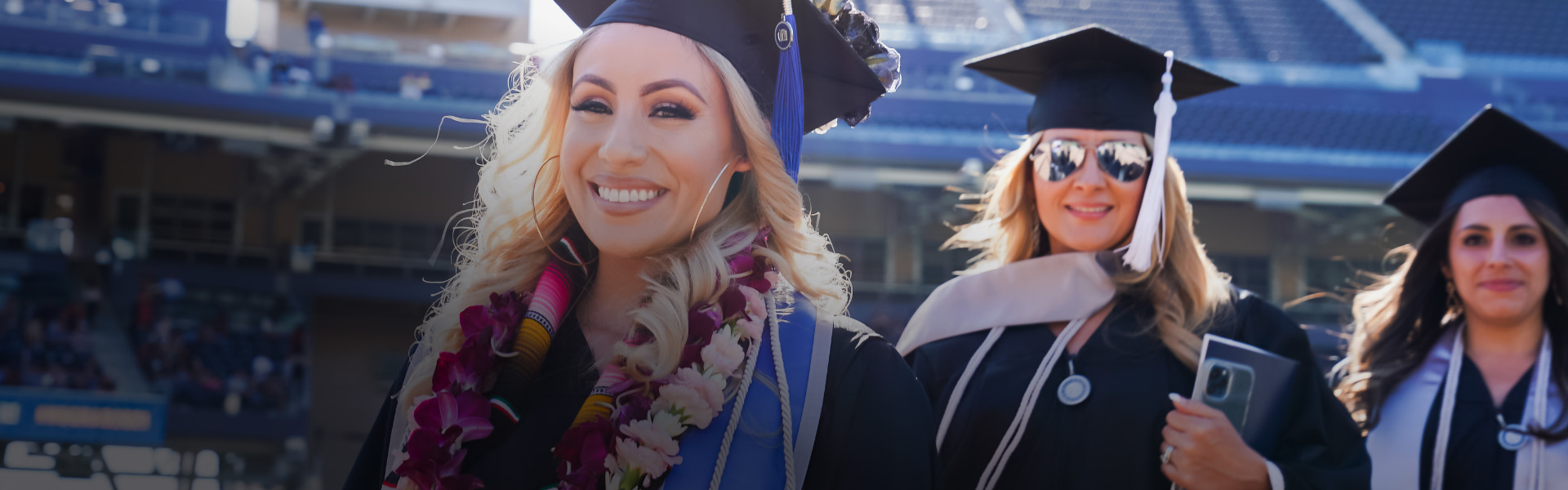 Graduates at commencement in line